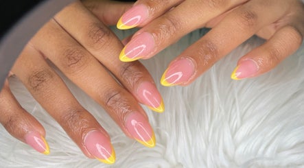 Vibrant yellow-tipped nails at Wino'S Nail Pub in Gaborone, Gaborone City, BW, showcasing trendy nail art.