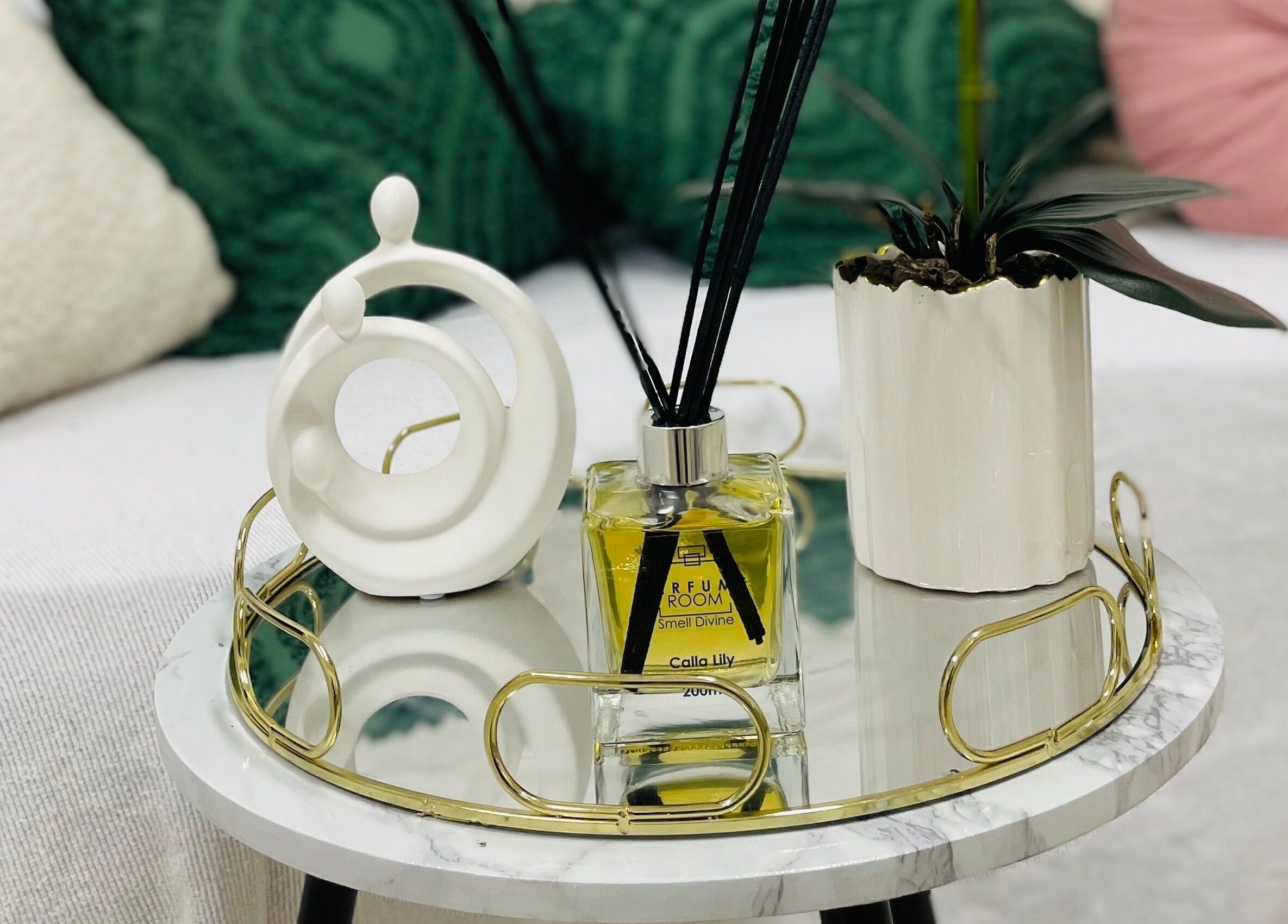 Chic decor with diffuser and plant on table at Wino'S Nail Pub, Gaborone City, BW.