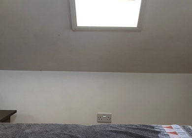 Serenity Massage room with skylight and soft linens in Grampound, England, GB.