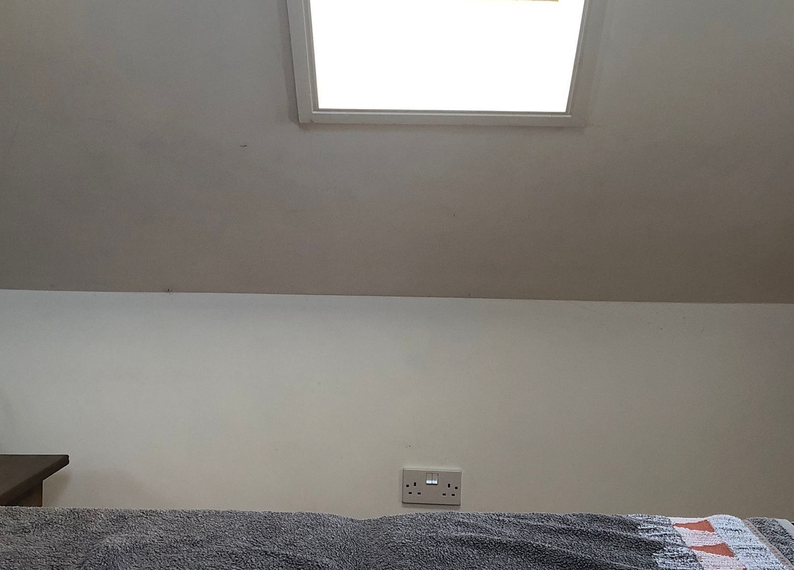 Serenity Massage room with skylight and soft linens in Grampound, England, GB.