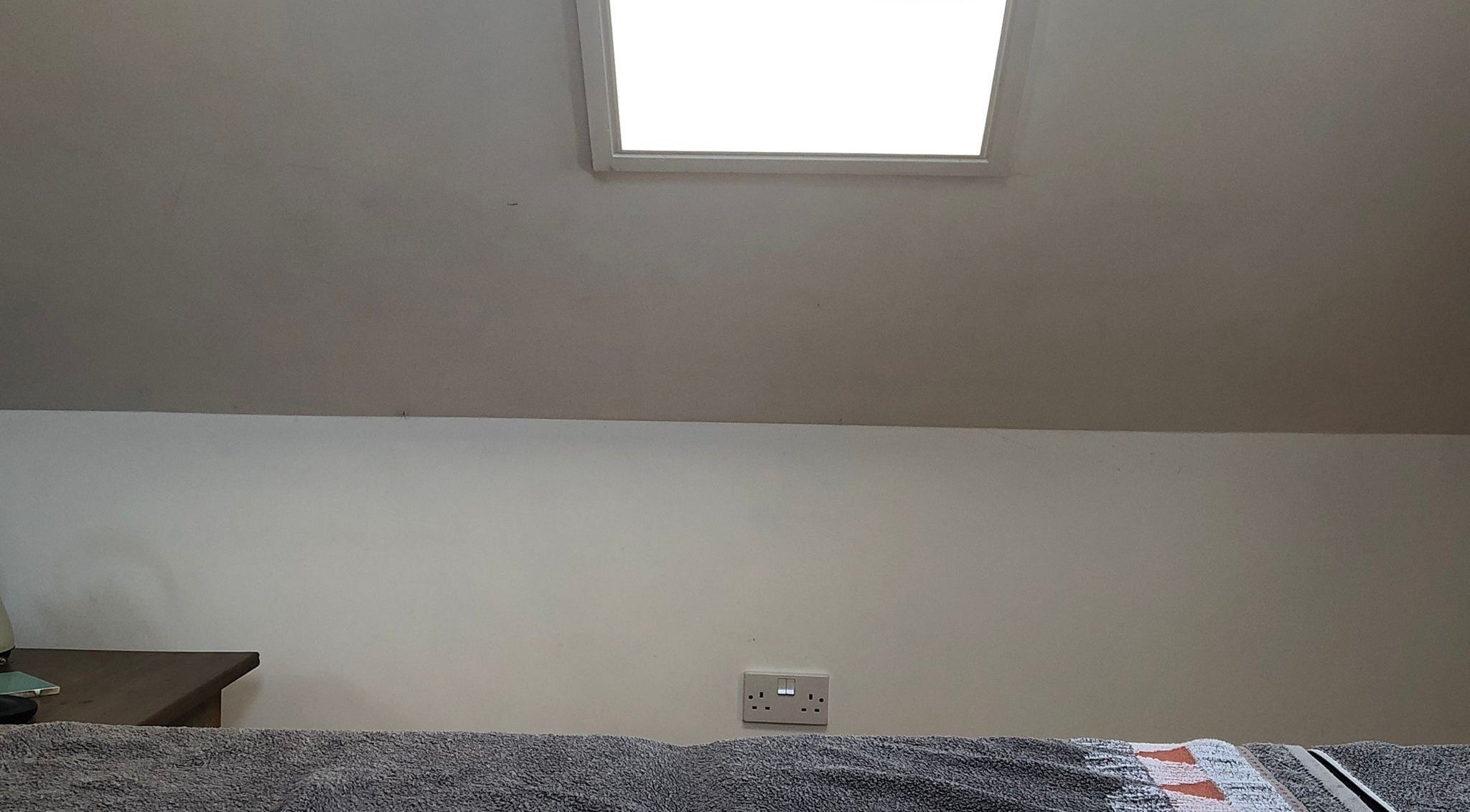 Serenity Massage room with skylight and soft linens in Grampound, England, GB.