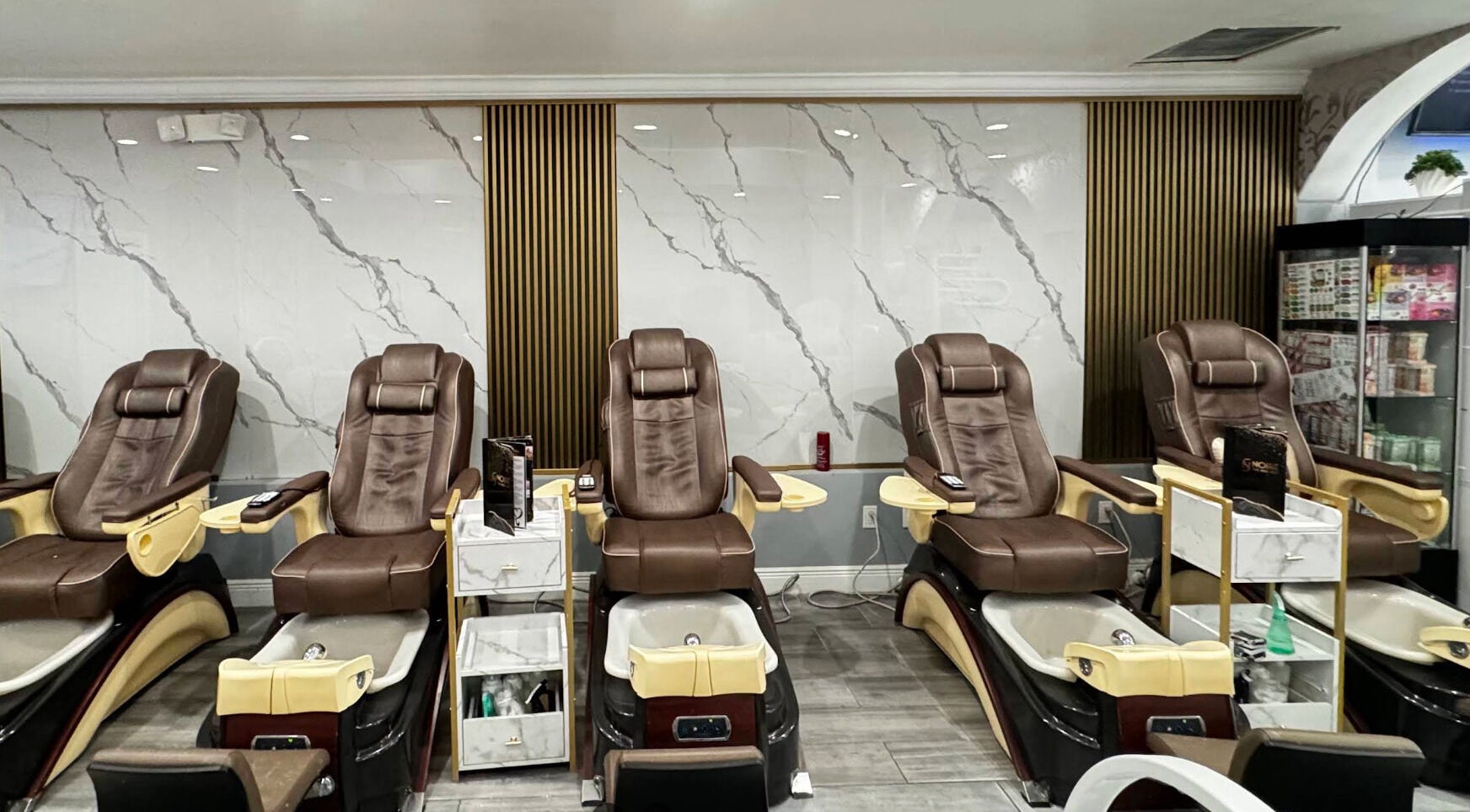 Luxurious spa chairs at Noire The Nail Bar - Bell Tower Shop, Fort Myers, FL, US.