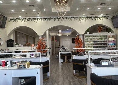 Elegant interior of Noire The Nail Bar - Bell Tower Shop in Fort Myers, FL, US showcasing modern nail stations.