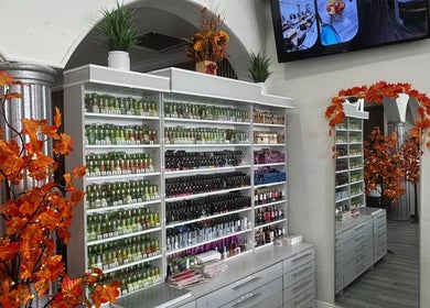 Elegant nail polish display at Noire The Nail Bar - Bell Tower Shop, Fort Myers, FL, US with fall decor.