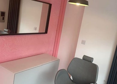 Modern styling area at Beauty By Ellie Louise, Marple, England, GB with sleek decor and pink accents.