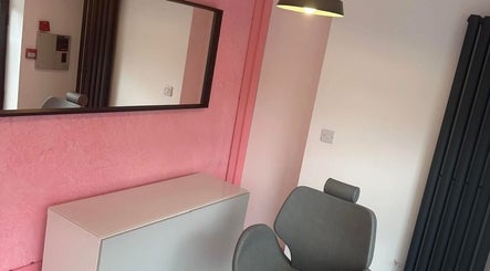 Modern styling area at Beauty By Ellie Louise, Marple, England, GB with sleek decor and pink accents.
