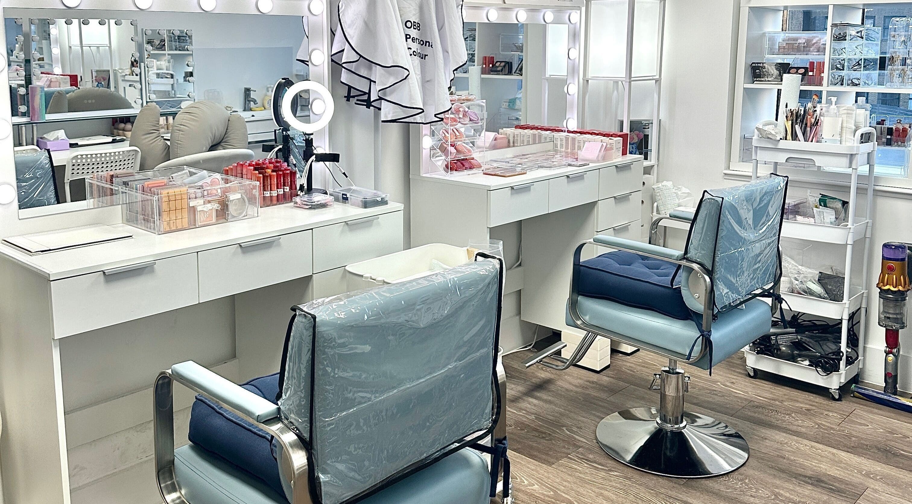 Beauty station at OBB Personal Colour, London, England, GB, showcasing chic salon setup with cosmetic tools.