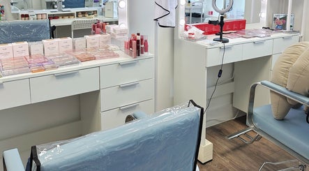 Cosmetics and beauty setup at OBB Personal Colour, London, England, GB with mirrors and makeup products.