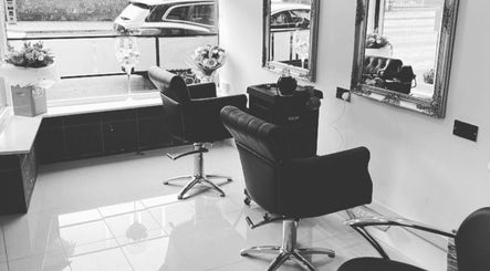 Elegant styling chairs and mirrors at NRG Hair Extensions, Glasgow, Scotland, GB, offering a serene ambiance.