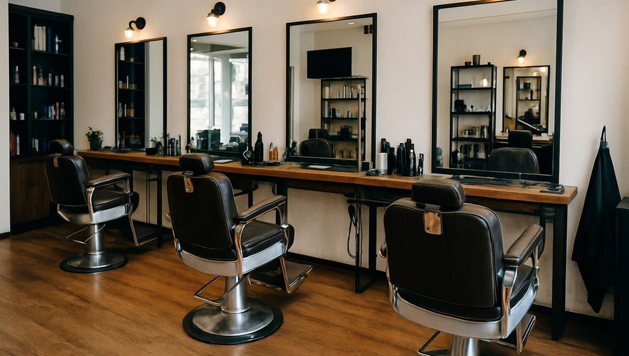 Elegant styling chairs and mirrors at KCuts, Sheboygan, US, showcasing a sophisticated salon interior.