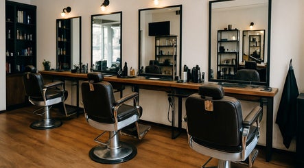 Elegant styling chairs and mirrors at KCuts, Sheboygan, US, showcasing a sophisticated salon interior.