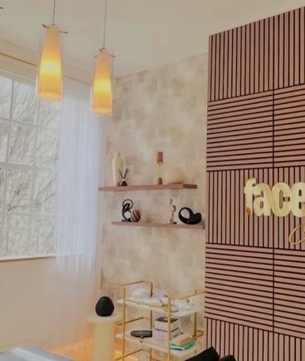 Elegant treatment room at Skin Sculptura, Liverpool, England, GB showcasing chic decor and natural light.