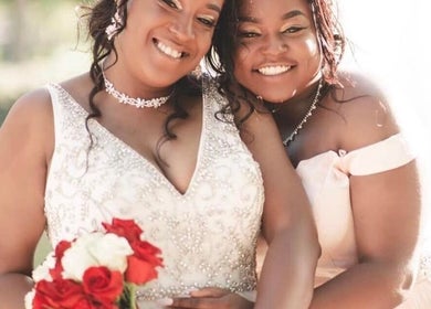 Smiling brides at Yours Truly, Jace, Los Angeles, California, US, embracing in elegant gowns.