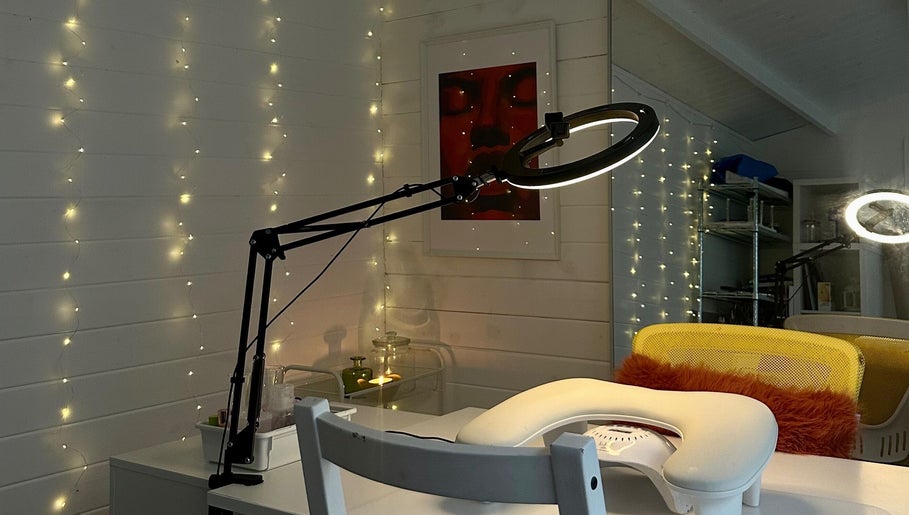 Inviting manicure station at Pinch Nails, London, England, GB, adorned with warm fairy lights.