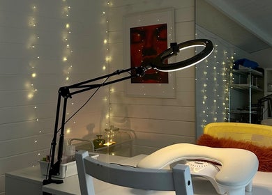 Inviting manicure station at Pinch Nails, London, England, GB, adorned with warm fairy lights.