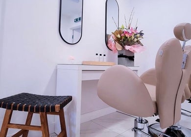Elegant salon setup at Bella Beauty By Sarah, Merthyr Tydfil, Wales, GB with stylish chairs and flowers.