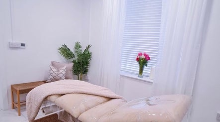 Relaxing therapy room at Bella Beauty By Sarah, Merthyr Tydfil, Wales, GB, featuring a cozy bed and serene decor.