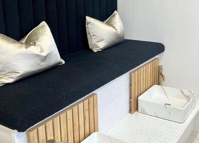 Luxurious seating area at Bella Beauty By Sarah in Merthyr Tydfil, Wales, showcasing chic decor and relaxation space.