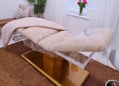 Relaxing treatment room at Bella Beauty By Sarah in Merthyr Tydfil, Wales, GB featuring a cozy massage bed.