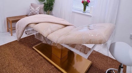 Relaxing treatment room at Bella Beauty By Sarah in Merthyr Tydfil, Wales, GB featuring a cozy massage bed.