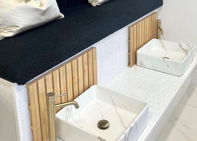 Elegant foot spa at Bella Beauty By Sarah in Merthyr Tydfil, Wales, GB, with marble basins and plush seating.