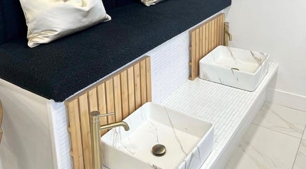 Elegant foot spa at Bella Beauty By Sarah in Merthyr Tydfil, Wales, GB, with marble basins and plush seating.