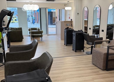 Modern and stylish beauty lounge at Rejuvenate@45, Stockport, England, GB showcasing elegant chairs and decor.