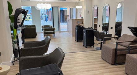 Modern and stylish beauty lounge at Rejuvenate@45, Stockport, England, GB showcasing elegant chairs and decor.