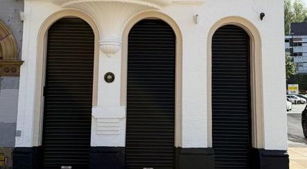 Exterior of Rejuvenate@45 in Stockport, England, GB with three elegant arched entrances.