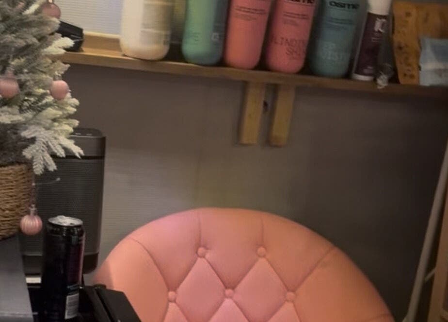 Cozy seating area with pink chair and products at Created by Courtney, Birmingham, England, GB.