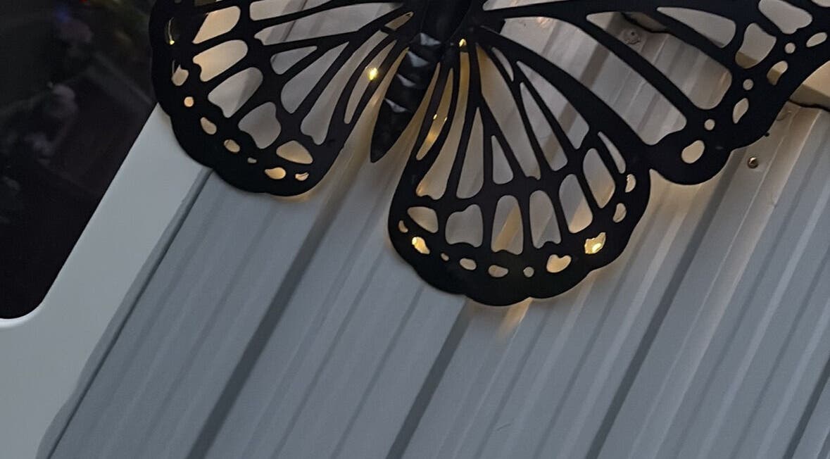Illuminated butterfly wall decor at Created by Courtney, Birmingham, England, GB.