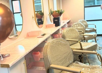 Chic salon interior of MasterCraft Hair in Sheffield, England, GB with stylish chairs and elegant decor.