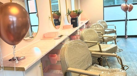 Chic salon interior of MasterCraft Hair in Sheffield, England, GB with stylish chairs and elegant decor.