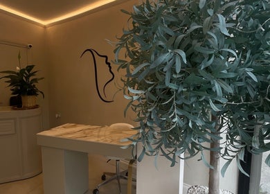 Tranquil reception at Haus of Nails, Birmingham, England, GB, with stylish decor and lush plants.