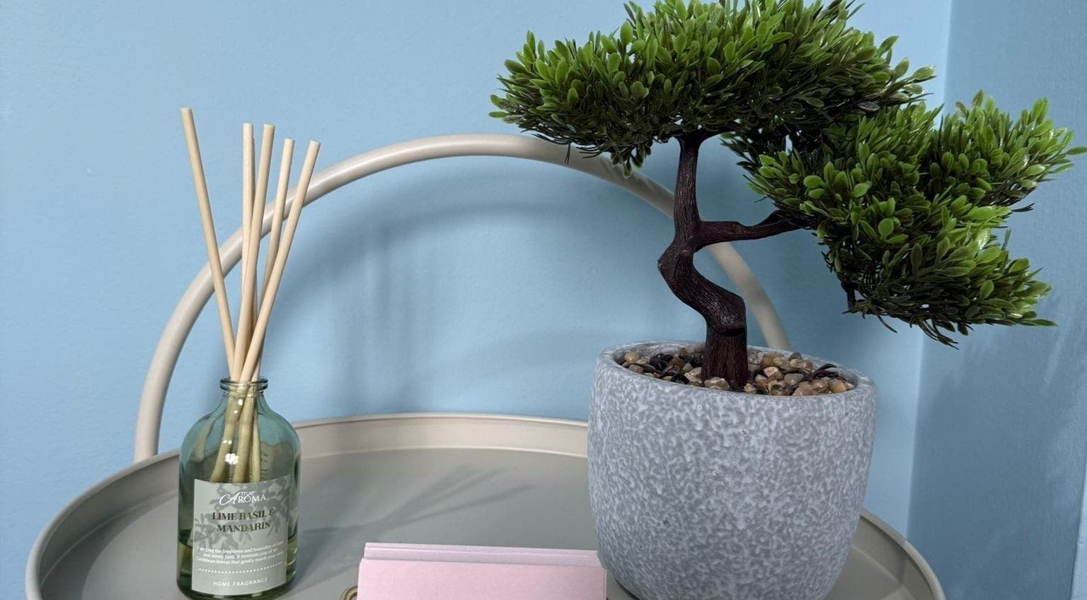 Peaceful decor at Key Aesthetics in Swindon, England, GB featuring a bonsai and diffuser on a table.