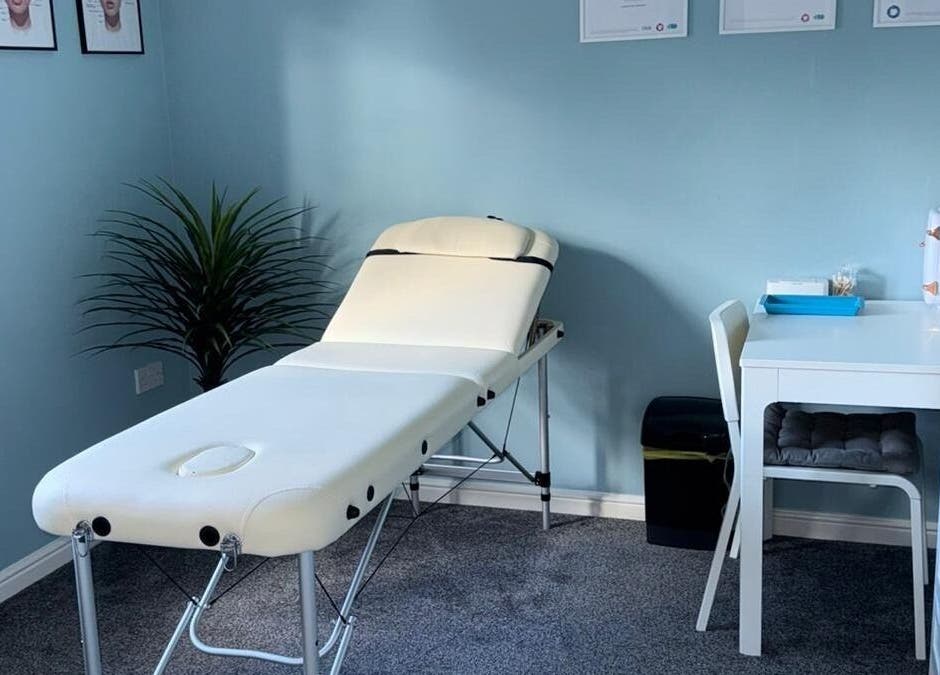 Tranquil treatment room at Key Aesthetics in Swindon, England, GB featuring a comfortable massage bed.