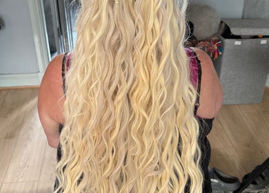 Blonde wavy hair styled at Braids, Waves, Dreads in Kilmarnock, Scotland, GB.