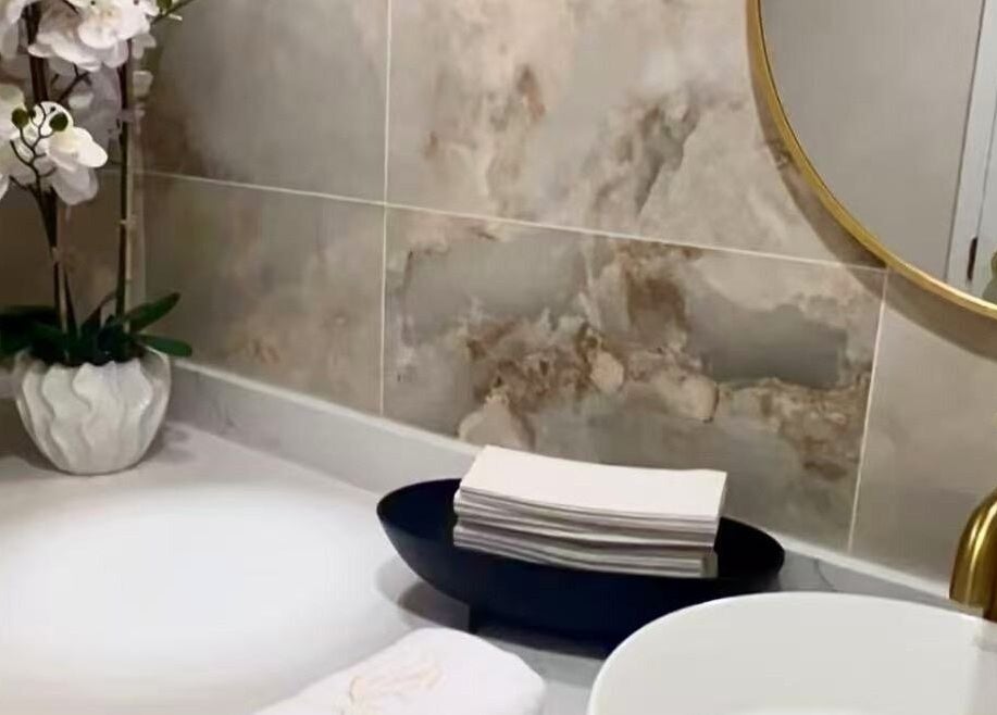 Luxurious vanity at LUMINA MEDI SPA, Mississauga, Ontario, CA with orchid decor and gold accents.