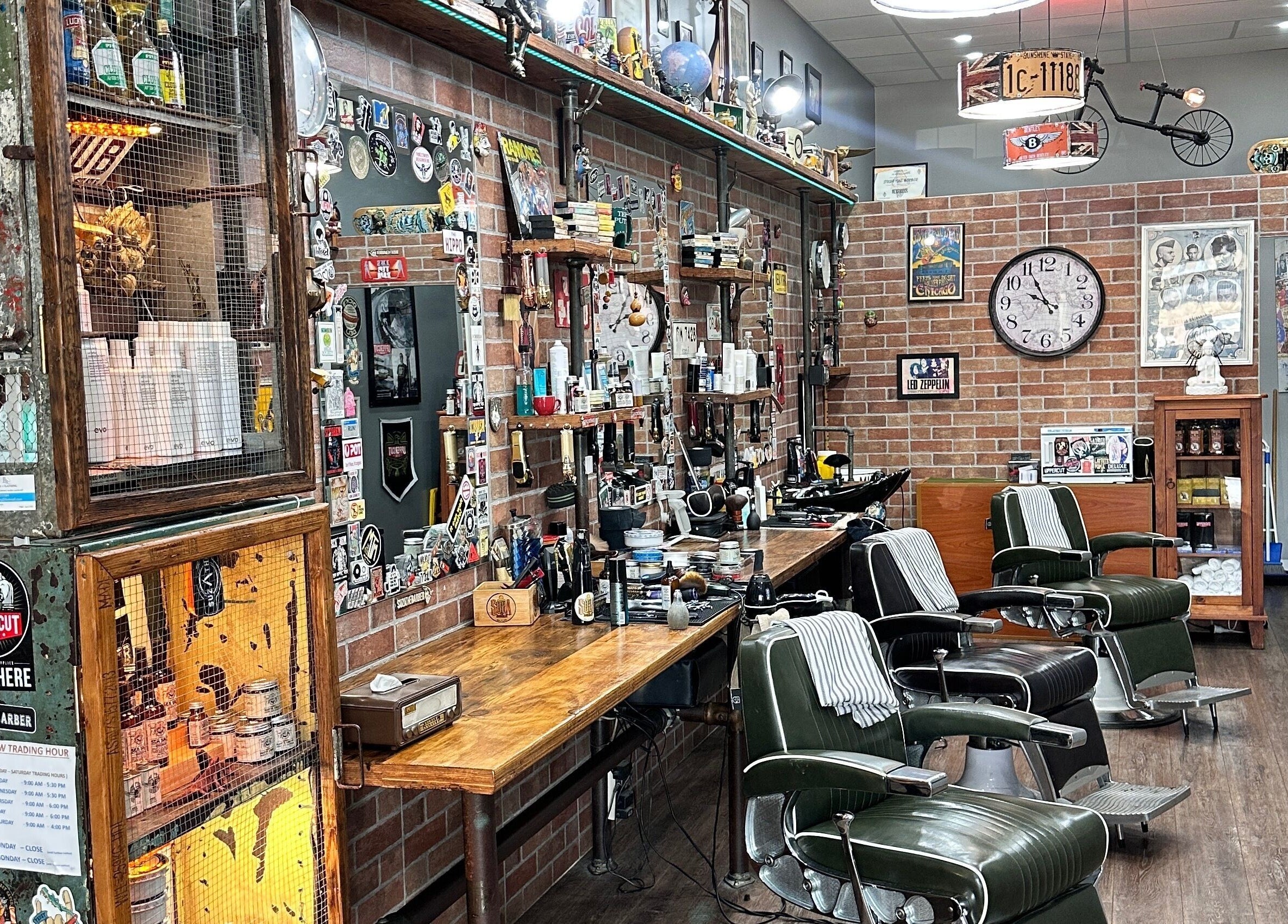 Cozy vintage barbershop interior at Suzathebarber, Millner, Northern Territory, AU, featuring classic chairs and decor.