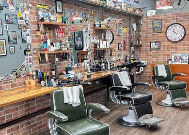 Suzathebarber's retro barbershop in Millner, Northern Territory, AU with leather chairs and rustic decor.