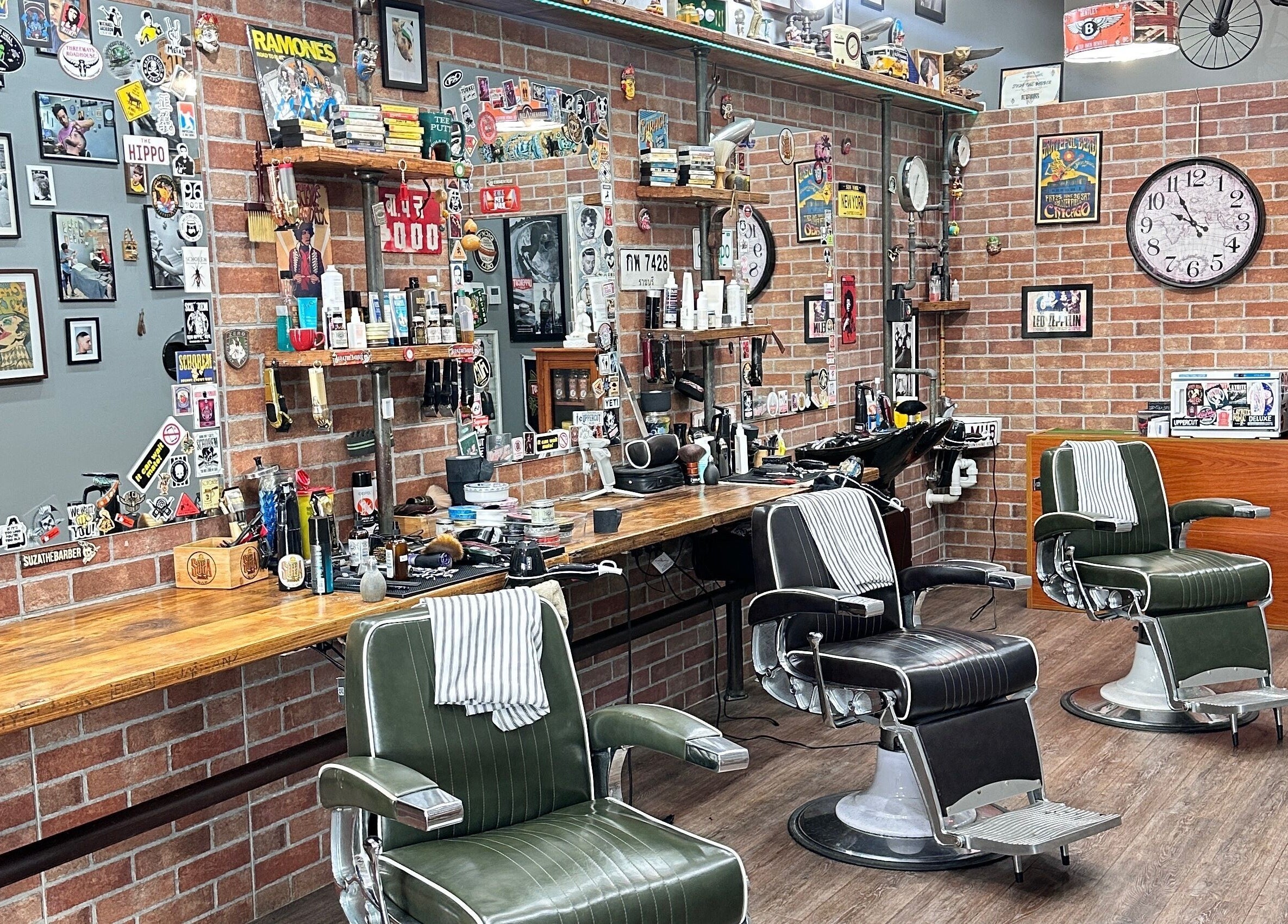 Suzathebarber's retro barbershop in Millner, Northern Territory, AU with leather chairs and rustic decor.