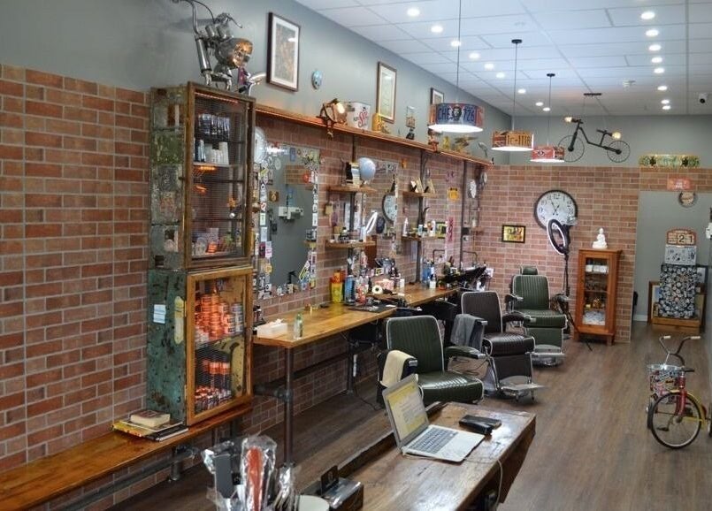 Inside Suzathebarber, Millner, Northern Territory, AU showcasing vintage barber chairs and decor.