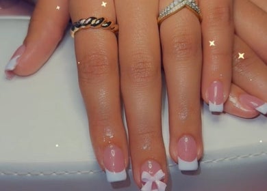 French manicure with pink and white tips at Clawed & Cute, Michigan, Michigan, US.