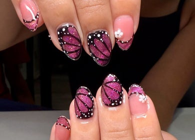 Intricate butterfly nail art from Clawed & Cute in Michigan, Michigan, US.