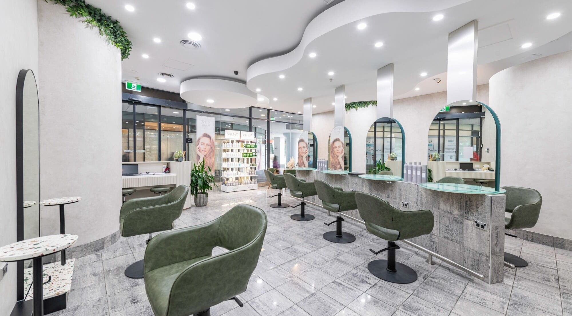 Interior of Monhairsalon in St Leonards, AU, featuring stylish seating and modern design.