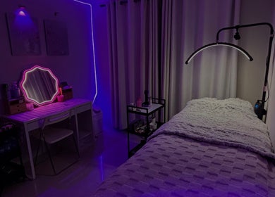 Tranquil beauty room at BeautyBlessed Co, Baldivis, Western Australia with ambient lighting and cozy bed.