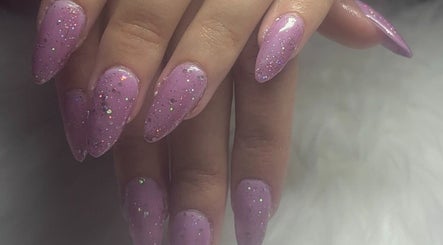 Purple glitter nails at Solembeauty, Labrador, Queensland, AU, showcasing stylish manicure.
