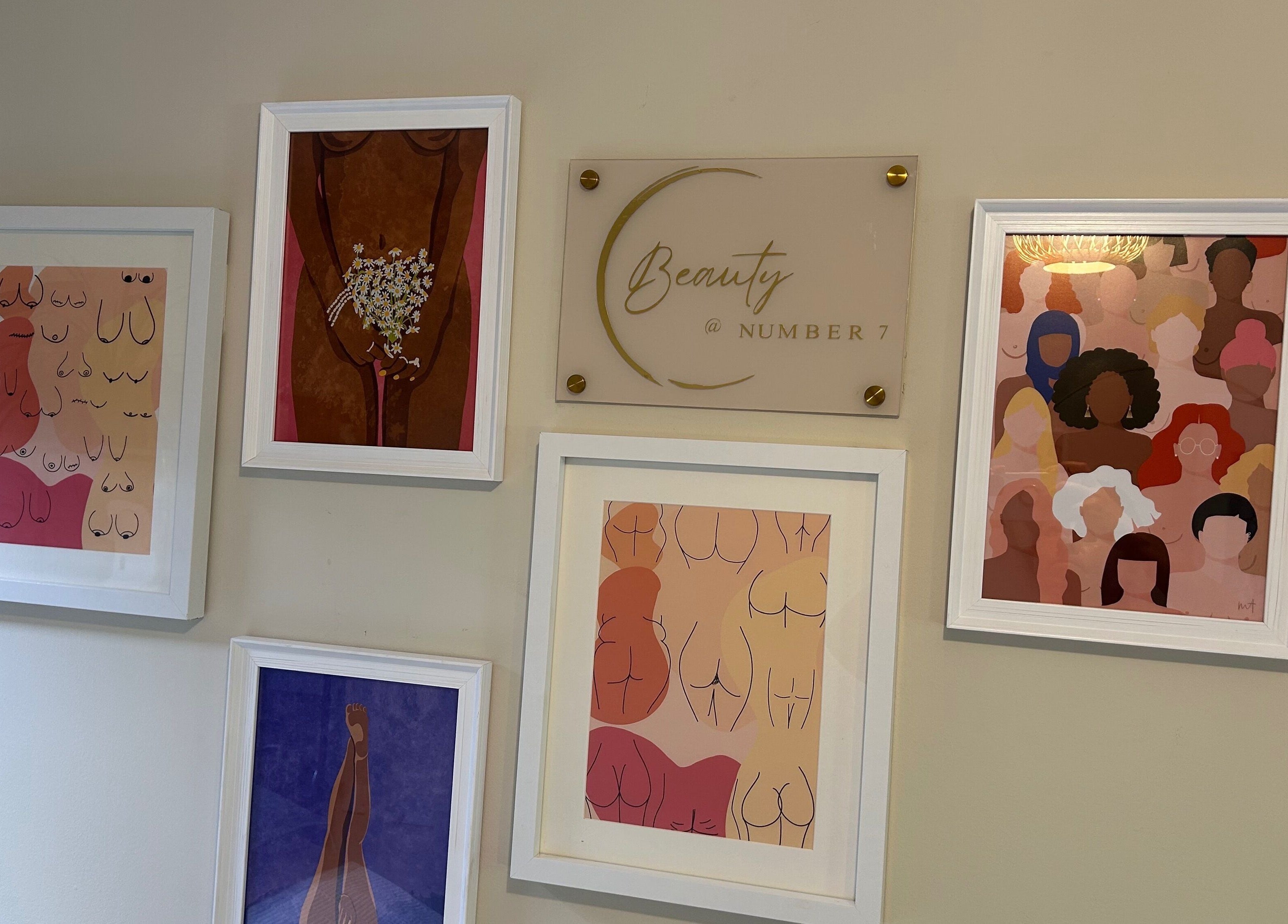 Artwork display at Beauty Number 7 in Kilmacthomas, County Waterford, IE, showcasing diverse body illustrations.
