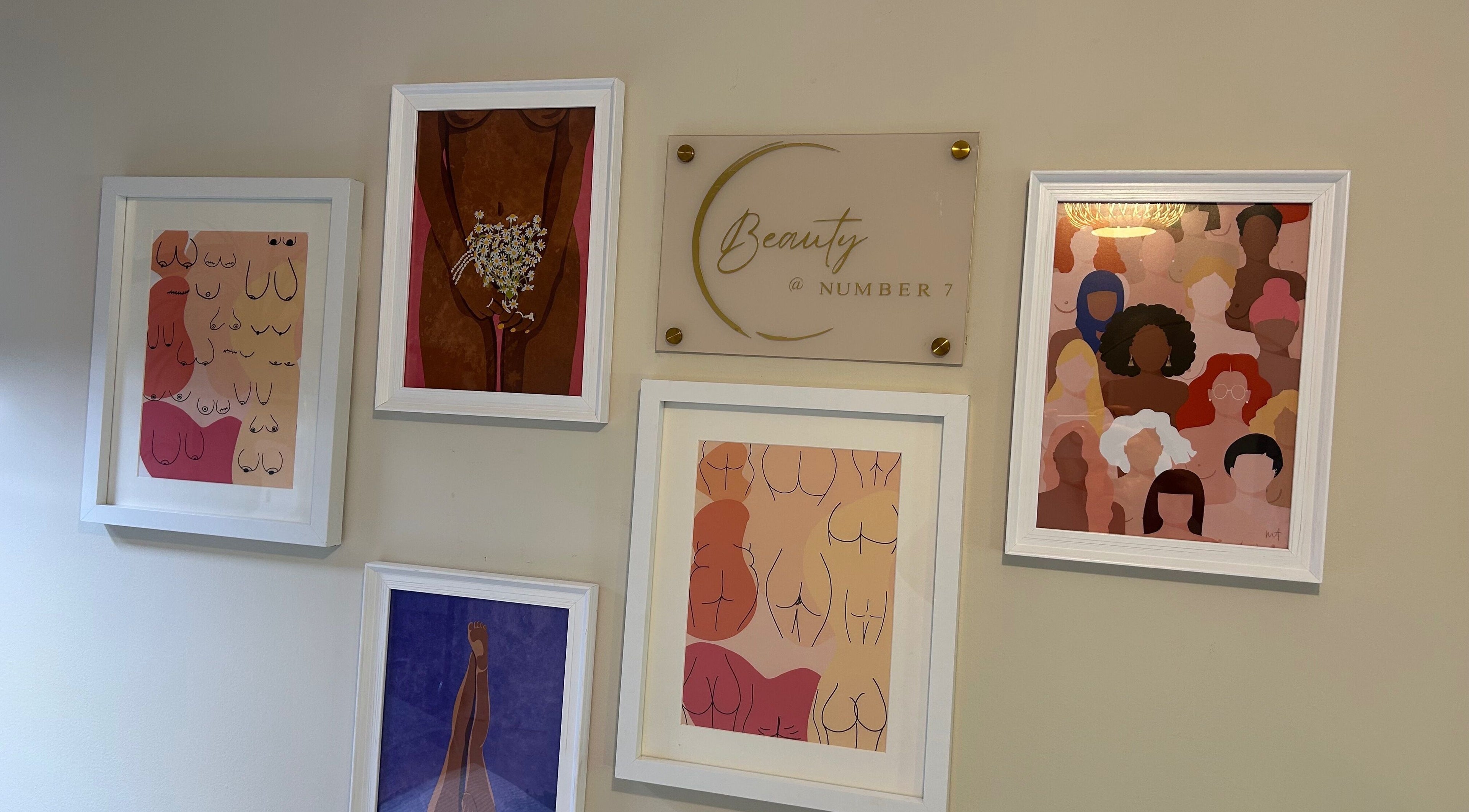 Artwork display at Beauty Number 7 in Kilmacthomas, County Waterford, IE, showcasing diverse body illustrations.