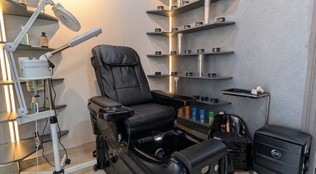Luxury pedicure station at Trend Style Gents Salon, Dubai, Dubai, AE with plush seating and beauty shelves.